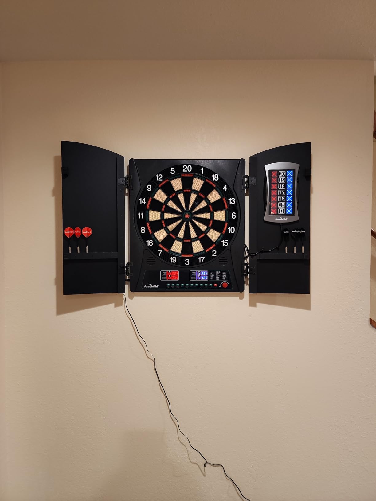 Arachnid CricketMaxx 1.0: 13.5” recreation size with wood cabinet. Features 34 games, 183 variations, 8-player LED X/O scoring, and Heckler mode. Integrated storage for darts and accessories customer photo 2